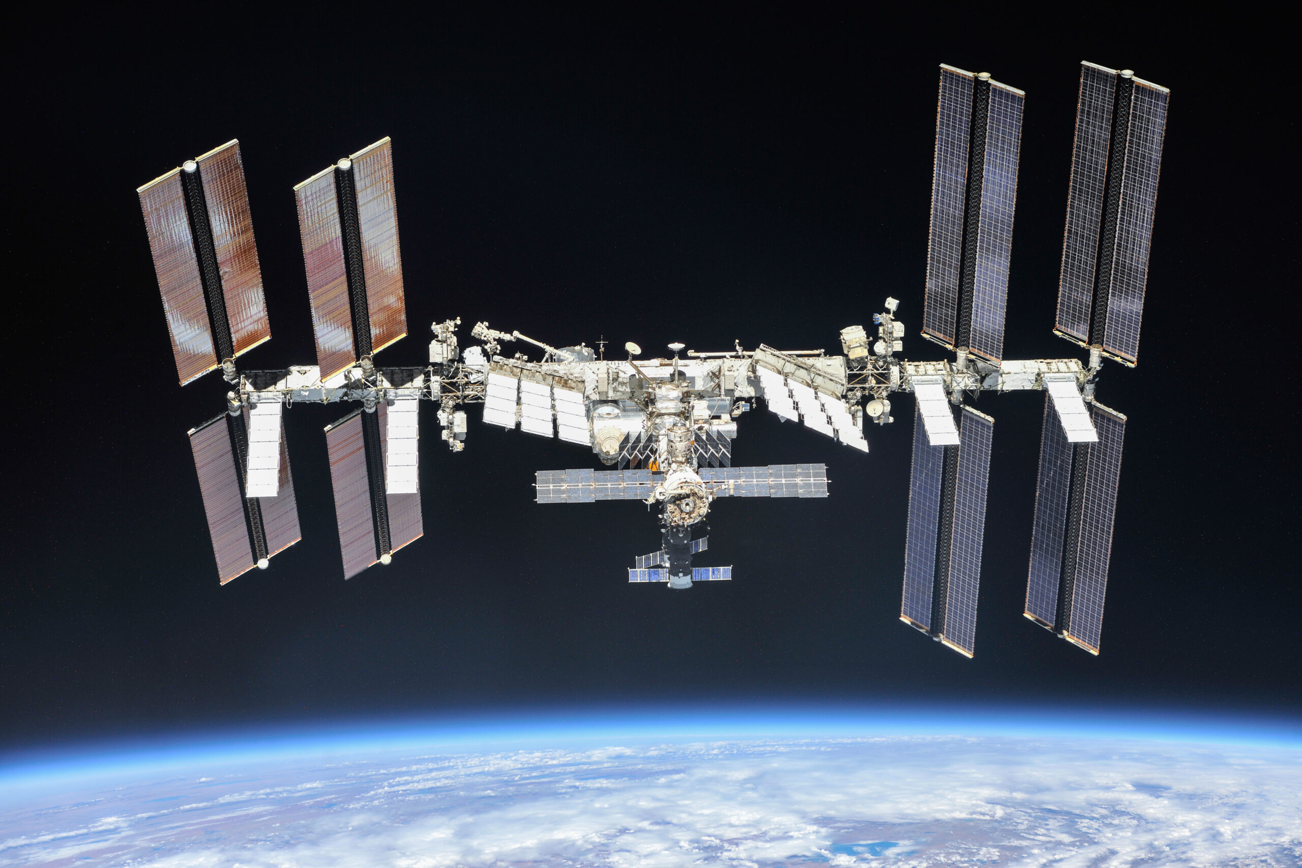 ISS-56 International Space Station fly-around The International Space Station photographed by Expedition 56 crew members from a Soyuz spacecraft after undocking. NASA astronauts Andrew Feustel and Ricky Arnold and Roscosmos cosmonaut Oleg Artemyev executed a fly around of the orbiting laboratory to take pictures of the station before returning home after spending 197 days in space. The station will celebrate the 20th anniversary of the launch of the first element Zarya in November 2018.